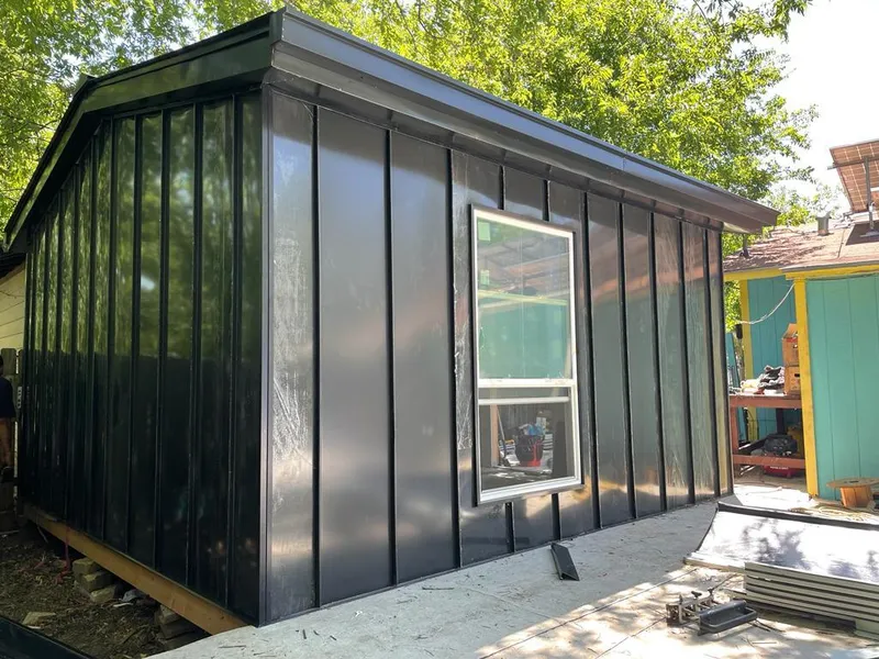 Black standing seam metal wall panels for Roof Inspection in Fargo