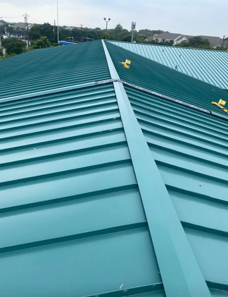 Green commercial metal roof ridge and valley for Metal Roof Repair in Fargo