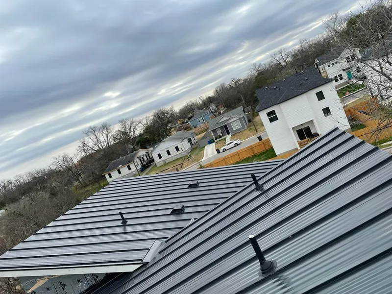 Standing seam metal roof panels with vents for Skylight Repair in Fargo